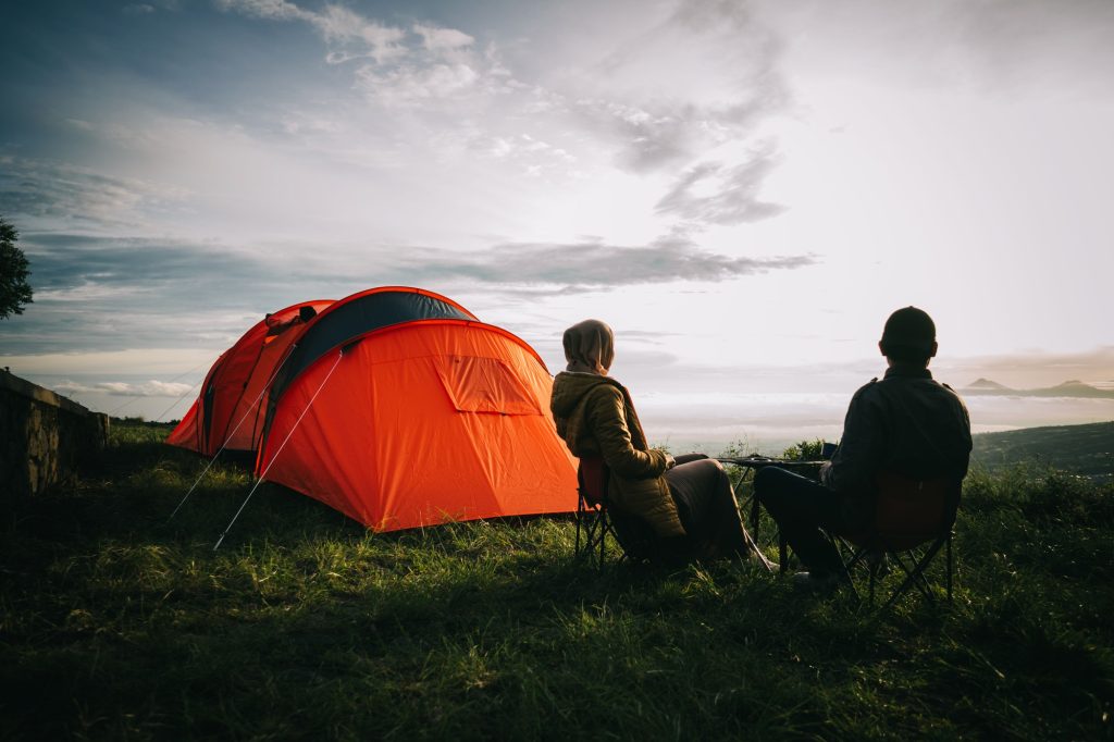 Paket Camping 1 asian couple camping with sunrise view in mountain